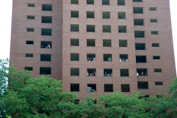 Several people went up into the buildings to watch